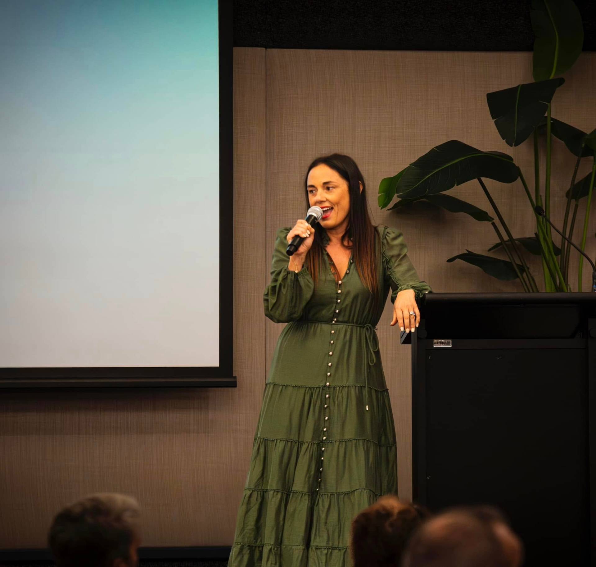 Joey Toutounji hosting an event with a microphone