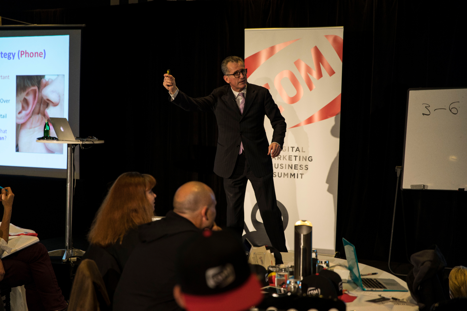 Steve Jensen speaking on stage